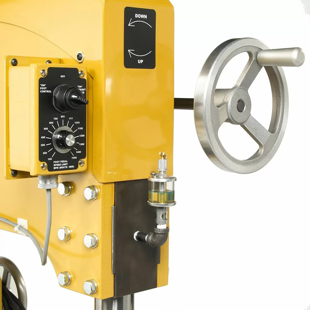 Yellow mechanical device with control panel and metal wheel on a white background
