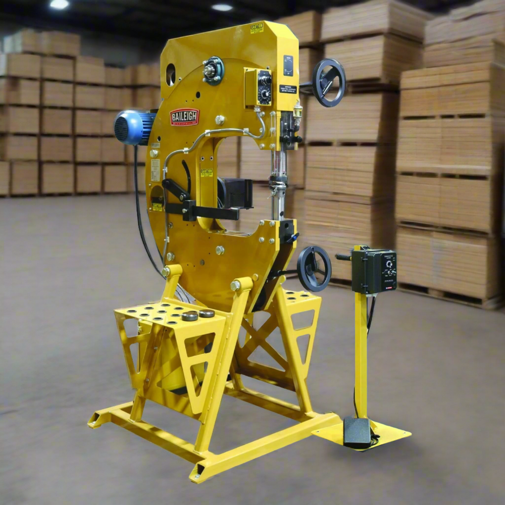 Yellow industrial machine in a warehouse setting with wooden pallets in the background