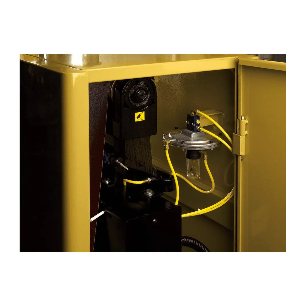Close-up of a yellow industrial machine with visible wiring and components.