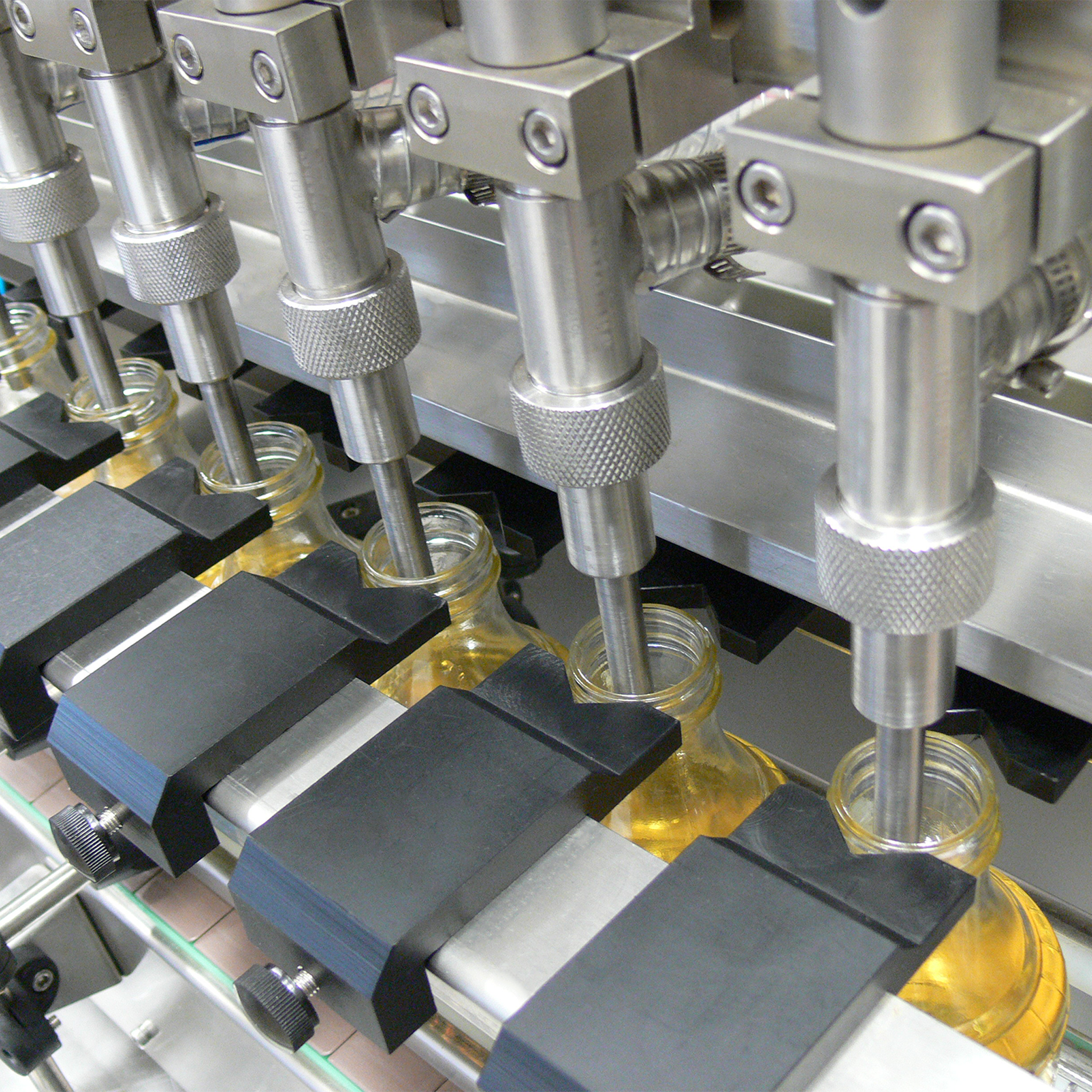 Jores Technologies 6 Head Inline Gravity Filling System with Conveyor - 1000 ml