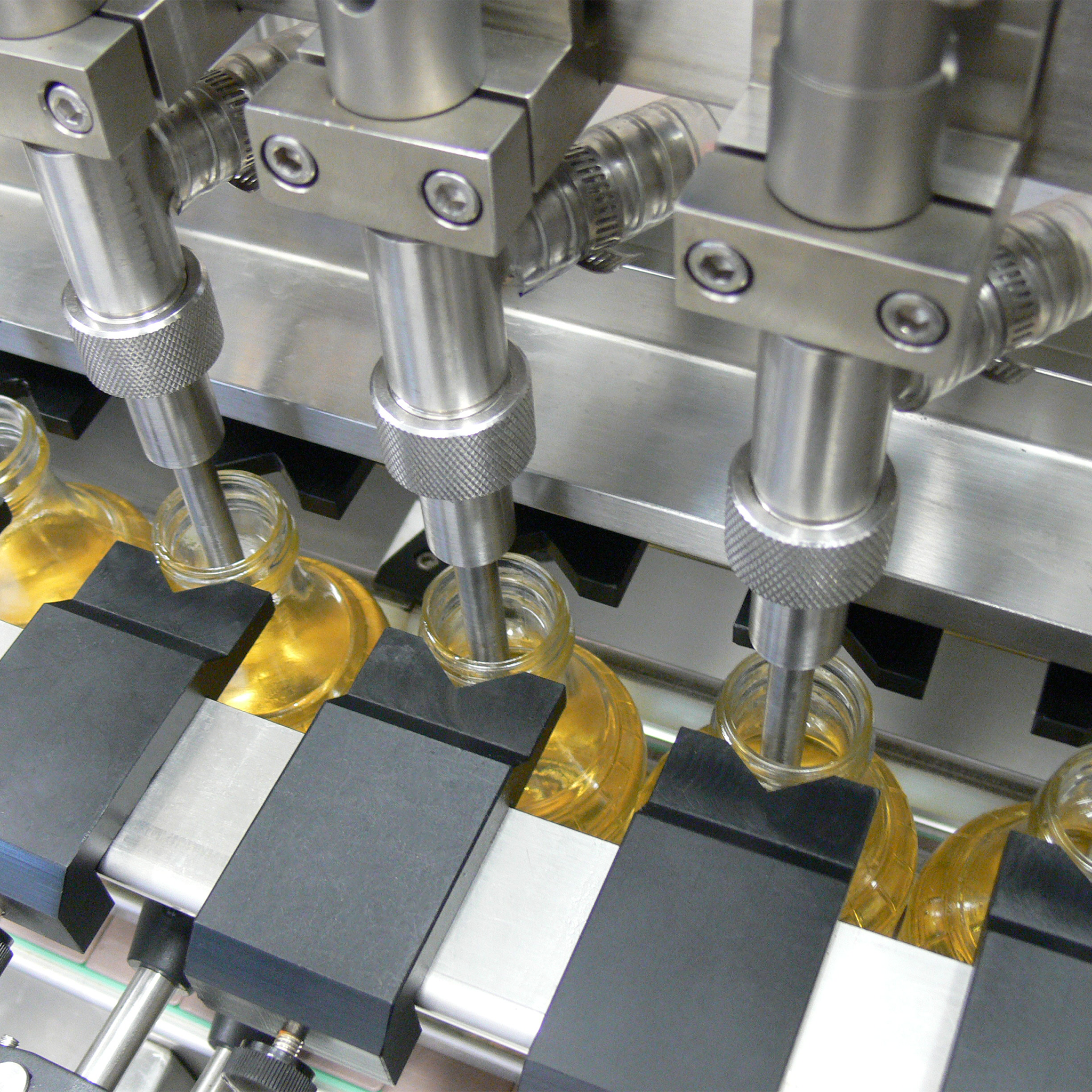 Jores Technologies 6 Head Inline Gravity Filling System with Conveyor - 1000 ml