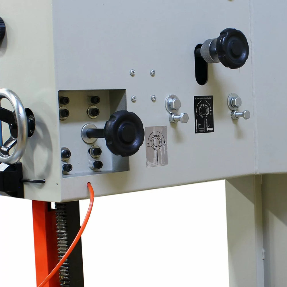 Close-up of a mechanical control panel with various knobs and switches on a white background.