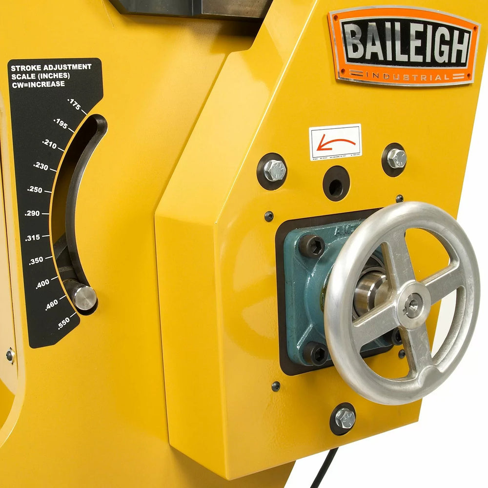 Yellow Baileigh industrial machine with a stroke adjustment scale and wheel.