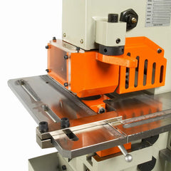 Close-up of a machine with an orange component on a white background