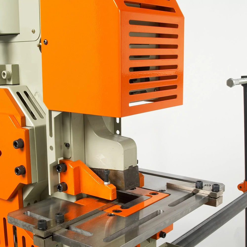 Orange and gray industrial band saw machine on a white background